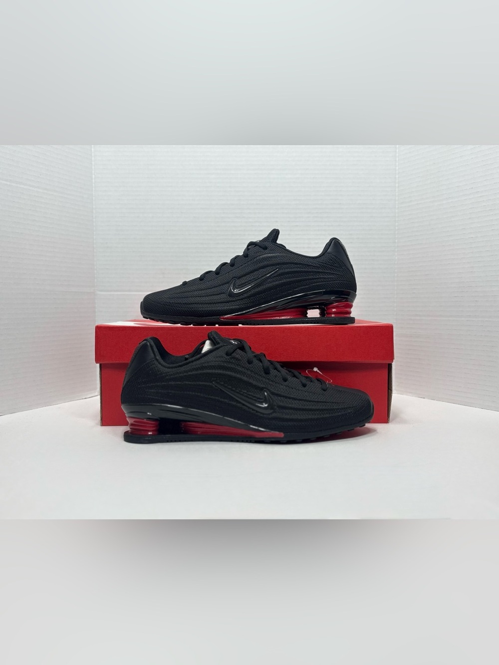 Nike shox Women's Black Athletic Shoes with Red Heel Accents